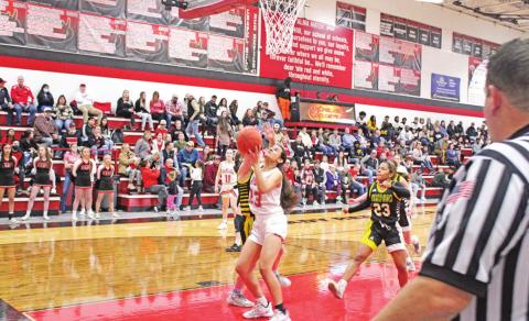 Mackenzie Espinoza battles to put up a layup during Chapel Hill’s Homecoming Game against Timpson Friday.