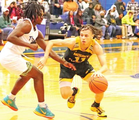 Payton Chism drives the ball against a Tyler defender. PHOTOS BY JOHN WHITTEN