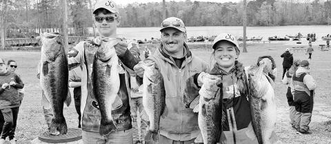 High school anglers Mason McCormick (left) and Alexis Virgillito (right) recently weighed in a 37.13-pound limit in a Louisiana Bass Nation high school tournament on Caney Lake. It may be the heaviest single day weight ever recorded in high school fishing tournaments. The young anglers were captained by Brad Virgillito (center). COURTESY PHOTO