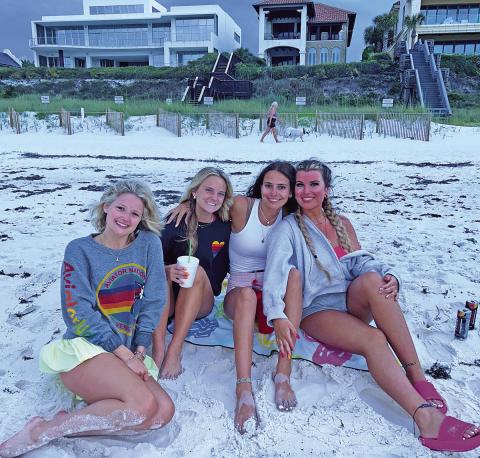 Carson, Conlee, Katy, and Ella posing together on Rosemary Beach during their senior trip (Courtesy of CARSON ZACHRY, CONLEE ZACHRY, ELLA CROSS, AND KATY MONK )