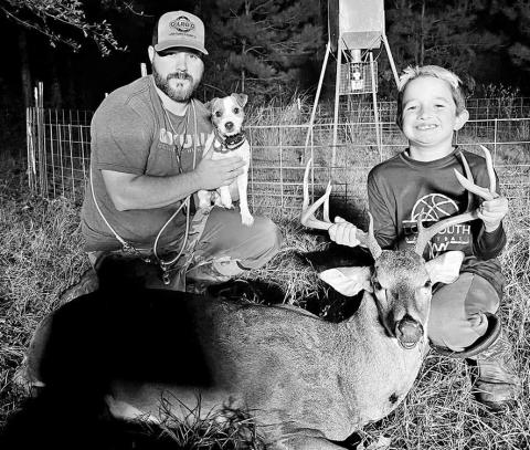 Deer tracker Jared Polasek and his Jack Russell Terrier “Scout” with the fruits of their labor. Polasek says one of worst things a hunter can do before calling in a tracking dog is grid searching the area. (Courtesy Photo, Jared Polasek)