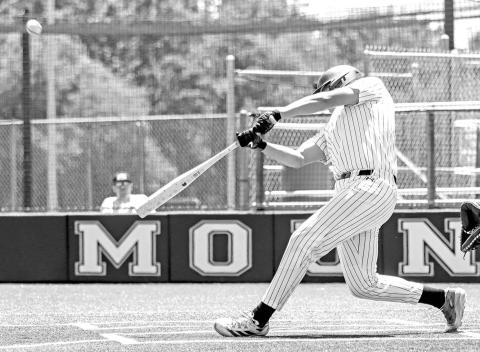 Nate Copado drives a fastball into the outfield against Melissa.