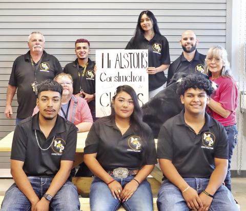 Front (L to R) Construction students Emilio Reyes, Jr., Addriana Cordova, Alan Nava. Center (L to R) MPHS Life Skills teacher James Townsend, Johnette Poole and one of her therapy dogs. Back (L to R) MPHS Construction instructors Jim Alston and Alan Salinas, MPHS Construction student Ailyen De La Rosa, MPHS Principal Craig Bailey COURTESY PHOTO