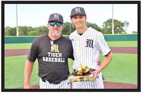 Mount Pleasant baseball Head Coach Tommy Stewart stands with Will Luck prior to the Tigers’ final home game of the season. Luck is the team’s lone senior and scored a run in Mount Pleasant’s win at Tyler Monday. COURTESY PHOTO