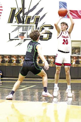 Chapel Hill’s Max Daniel (20) puts up a three-pointer in the first period against Paradise on Friday night in Kaufman.