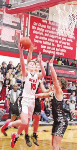 Braden Buchanan drives through the defense to attempt a layup during a recent game. TRIBUNE PHOTO / QUINTEN BOYD