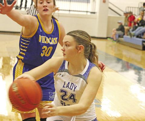 Rivercrest’s Macy Childres makes a pass during a recent game. The Lady Rebels won their district opener at Detroit, 56-41. Rivercrest traveled to Maud Tuesday and will host James Bowie Friday. TRIBUNE PHOTO / QUINTEN BOYD