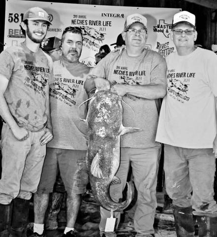 Hunter Kaemmerling, Shawn Kaemerrling and Brent Cotton won the $8,000 pot for catching the heaviest cat in the 3rd Annual Neches River Life Big Catfish tournament held April 14-15 on the Neches River. The flathead weighed 49.8 pounds. COURTESY PHOTO / SHELBY M. PHOTOGRAPHY