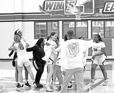 The Mount Pleasant Lady Tigers celebrate following their area round win over Crandall in Lindale. The undefeated, sixthranked Lady Tigers took on Huntsville Tuesday in Athens for a trip to the regional tournament. TRIBUNE PHOTO / QUINTEN BOYD