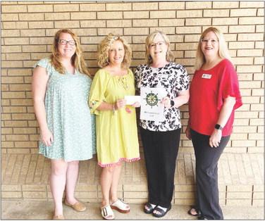 Pilot Club members Shelby Niblett, Denise Davis and Lydia Grimes make a donation to M.O.M, Ministering our Military. Accepting the donation is M.O.M organizer Kelly Cooper. M.O.M. is a nonprofit organization that provides care packages for active-duty military members. COURTESY PHOTO