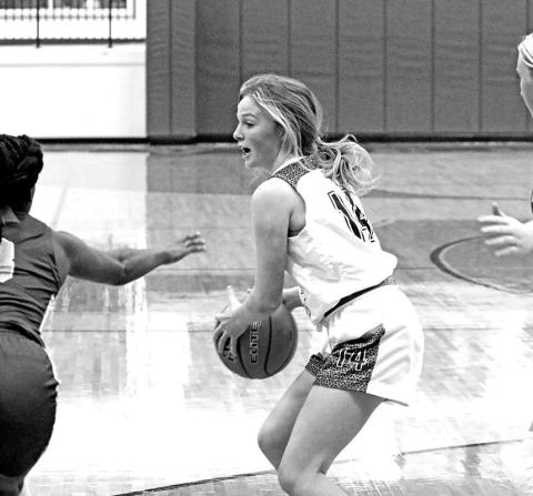 Rivercrest’s Abby Ross collects a loose ball during Tuesday’s game. The Lady Rebels remained unbeaten in district play with a 63-32 win over Detroit.