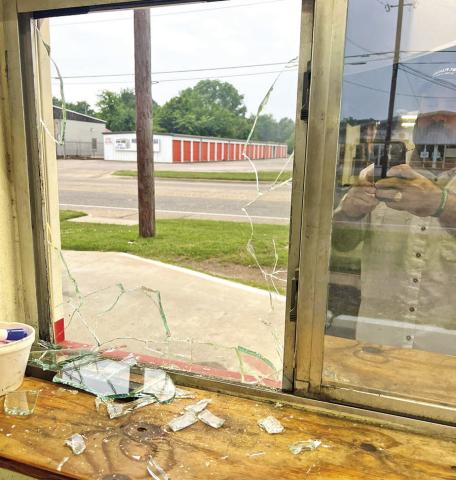 A window at the drive-thru of MP Burgers &amp; Fries broken during a robbery COURTESY PHOTO / MP BURGERS AND FRIES