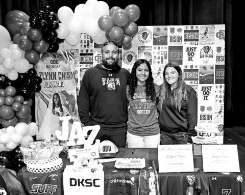 Jazlynn Chism with MPHS soccer coaches David Zaldivar (left) and Krissa Woods
