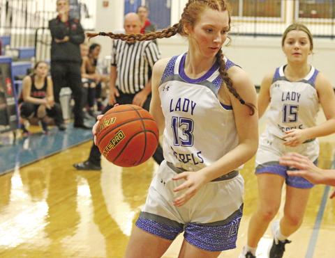 Abigail Scott brings the ball up the floor while teammate Logan Huddleston trails the play. The Rivercrest Lady Rebels sit in first place after the first round of district play.