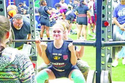 Senior Jordan West squats 220 lbs. West finished in 6th place.