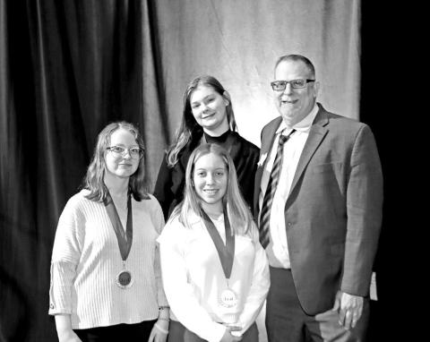 Computer Game and Simulation Programming National qualifiers (L to R) Charity Prater, Aloani Laboy, Isabella Furnish, and FBLA Advisor John Whitten