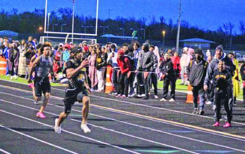 Mount Pleasant’s Dylan Bennett pulls away at the conclusion of the 100 meters at the Mount Pleasant Relays last week. Bennett ran a 10.92 to claim first in the event. TRIBUNE PHOTO / QUINTEN BOYD