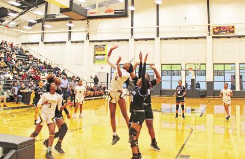 Aziyah Farrier puts up a shot during Mount Pleasant’s area round playoff game against North Forney. TRIBUNE PHOTO / QUINTEN BOYD