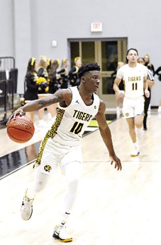 Tigers escape Hallsville 46-44, set win streak record